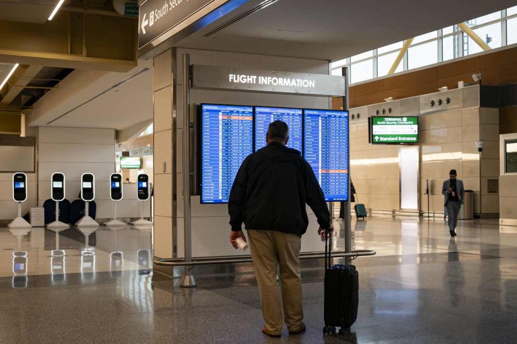 American travelers are booking fewer domestic flights in another warning sign for the economy